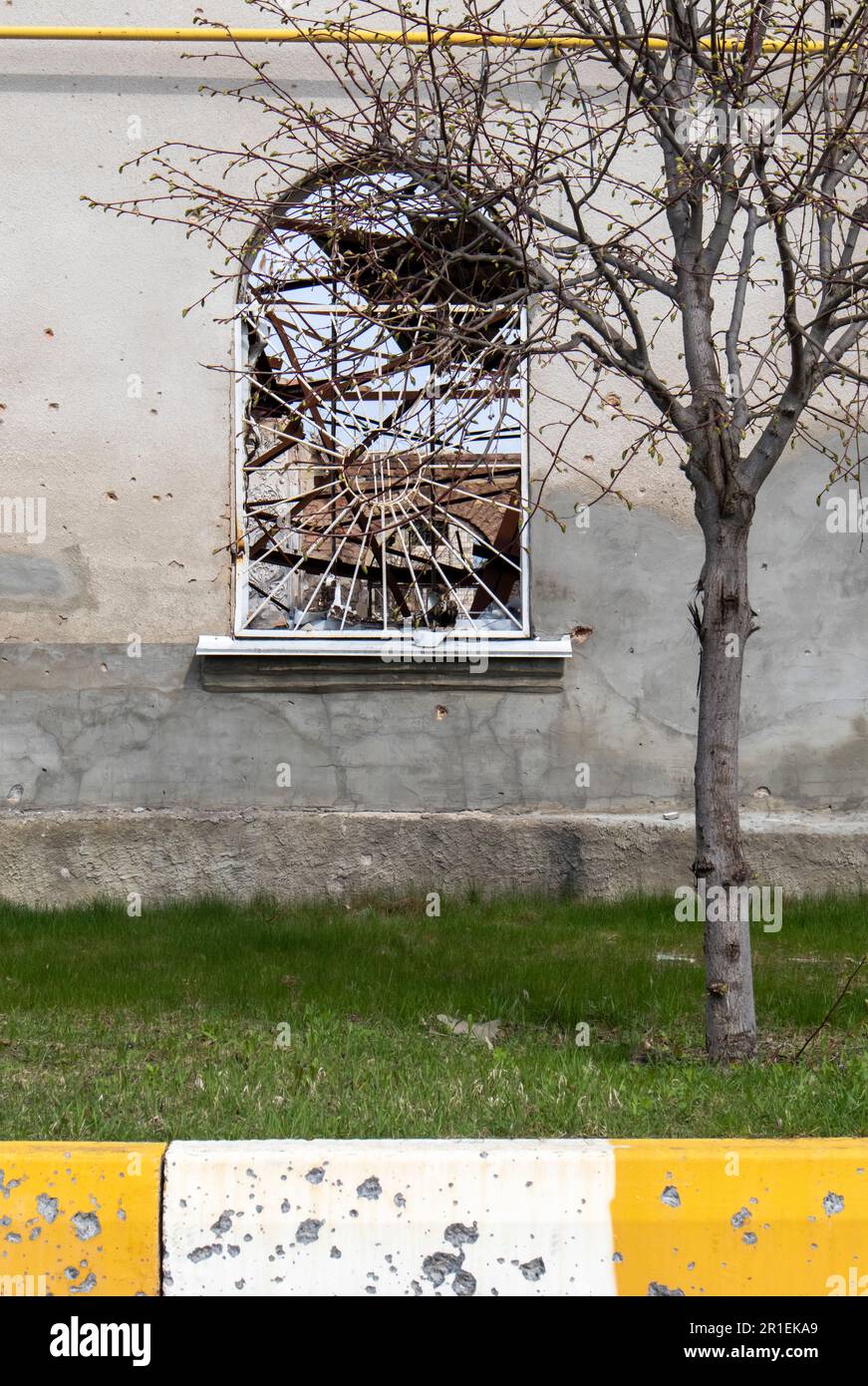 Destroyed and damaged window in the building as a result of the war ...