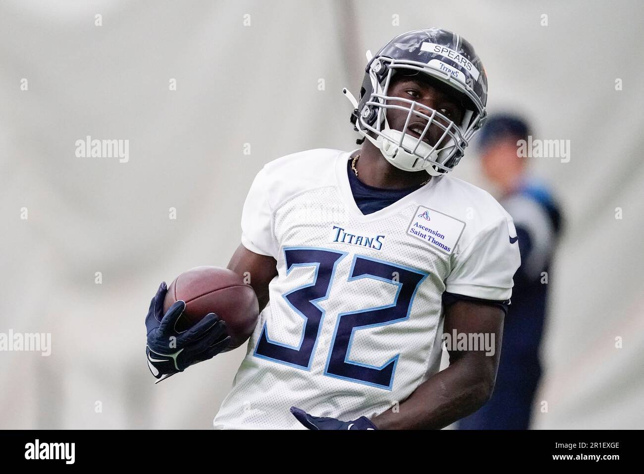 Tennessee Titans running back Tyjae Spears runs through drills during a rookie minicamp at the