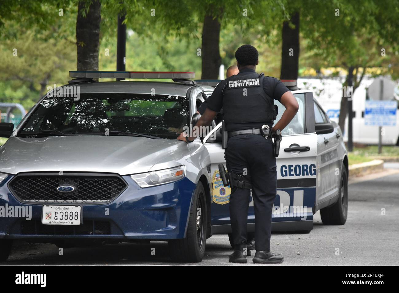 Prince George s County Police Department Officers converse with each other at the scene of the crime. At approximately 11 50 am Eastern Time Saturday May 13 2023 Prince George s County Police Departme...