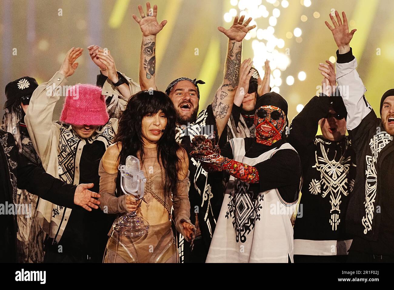 Sweden entrant Loreen is presented with the trophy by Kalush Orchestra after winning the Eurovision Song Contest at the M&S Bank Arena in Liverpool. Picture date: Saturday May 13, 2023. Stock Photo