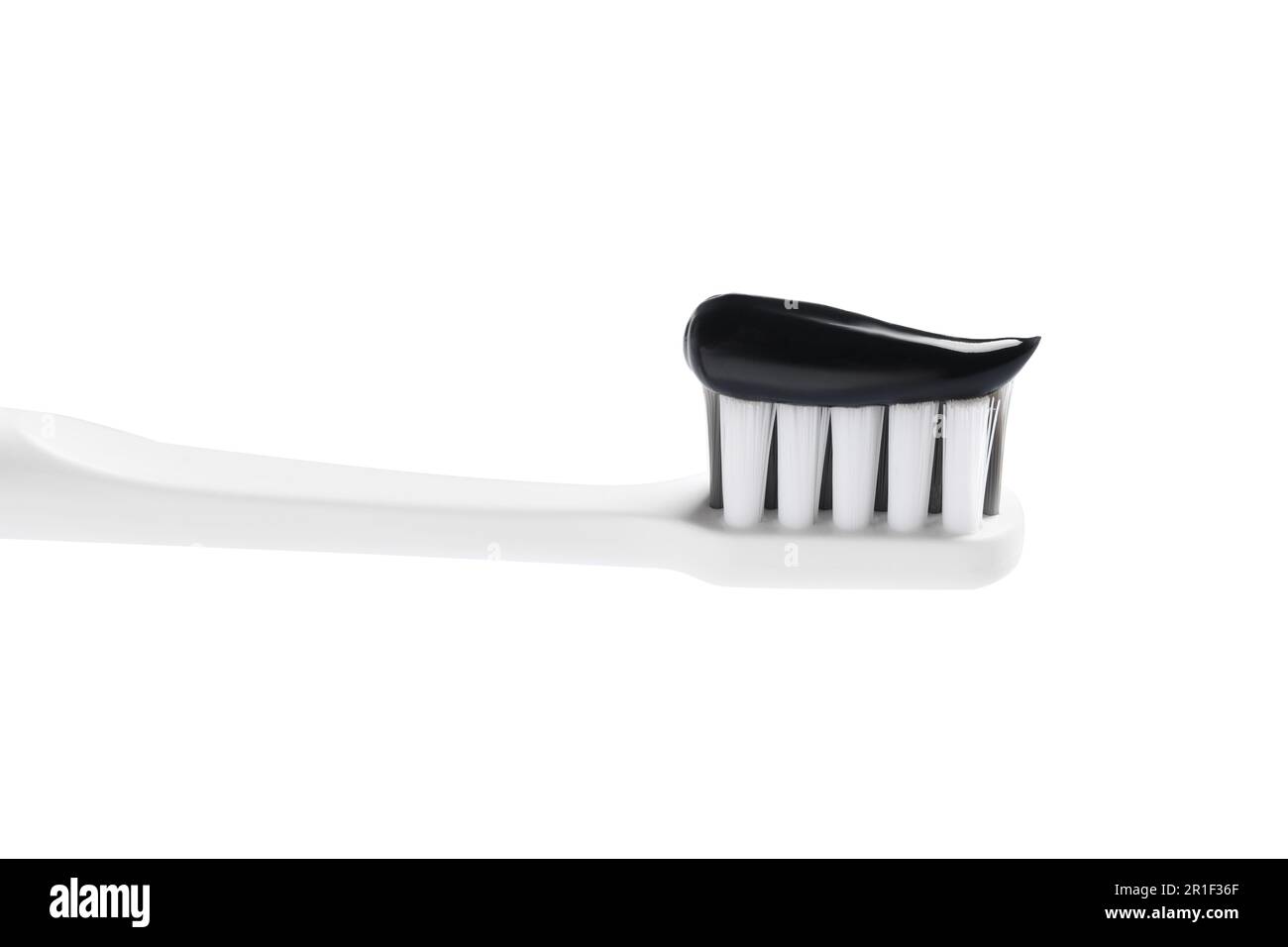 Brush with charcoal toothpaste isolated on white Stock Photo - Alamy