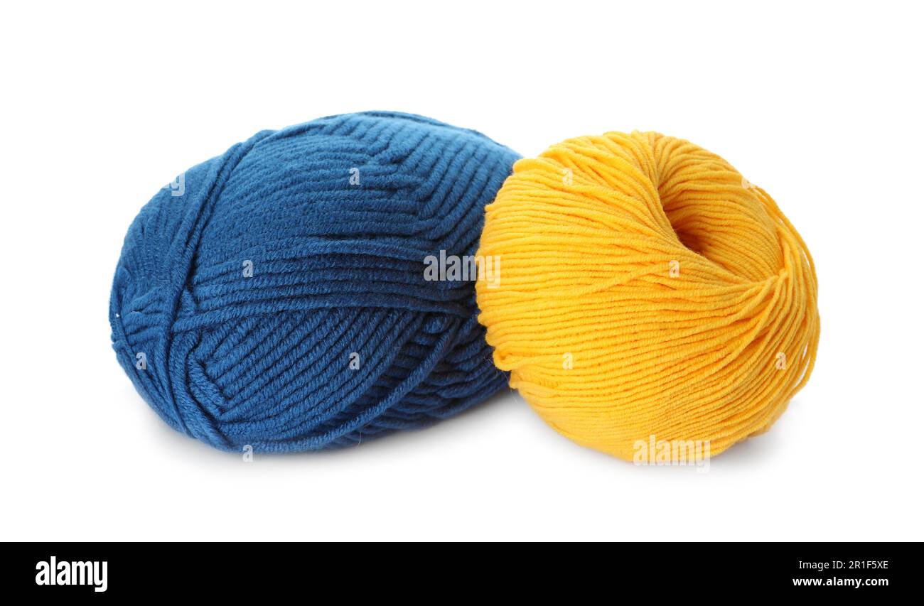 Blue and yellow balls of woolen knitting yarns on white background Stock Photo