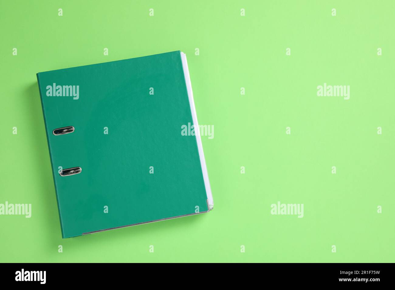 Office folder on light green background, top view Stock Photo