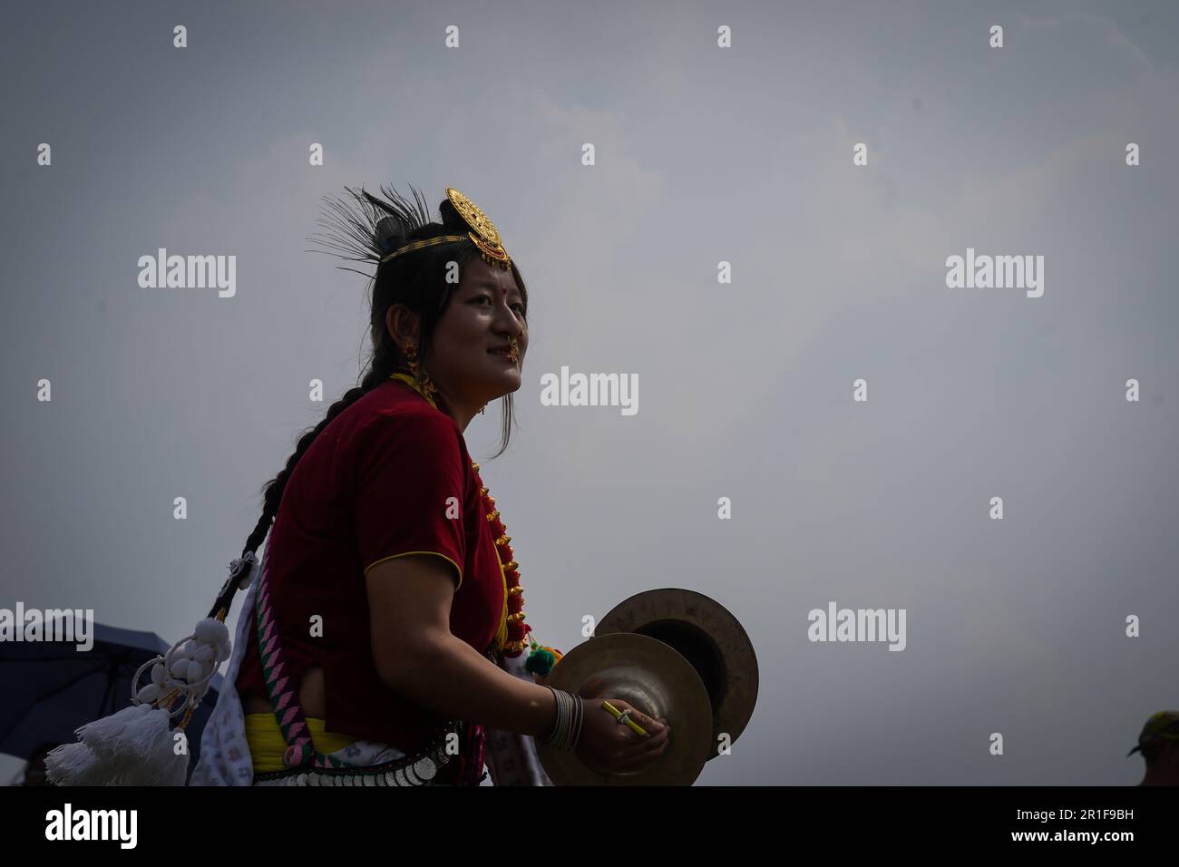 Kathmandu, Nepal. 13th May, 2023. A woman from the Kirat community