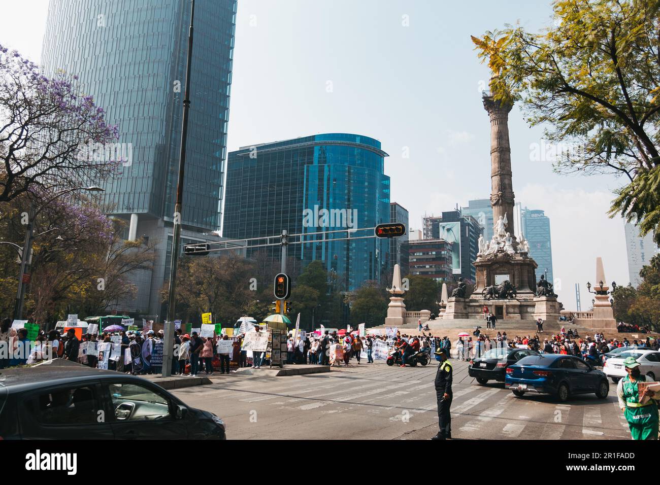 Protestors gather at the Angel of Independence statue on Paseo de la Reforma in Mexico City, Mexico Stock Photo
