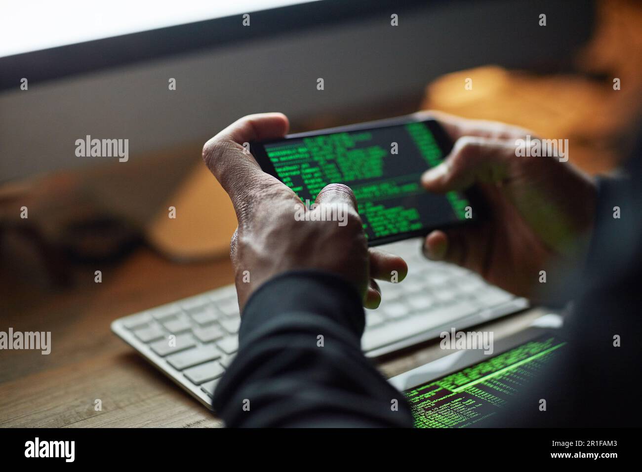 Hacking, phone screen and man hands for software data, crack code or password and internet or cybersecurity crime. Online, cyber thief and coding Stock Photo