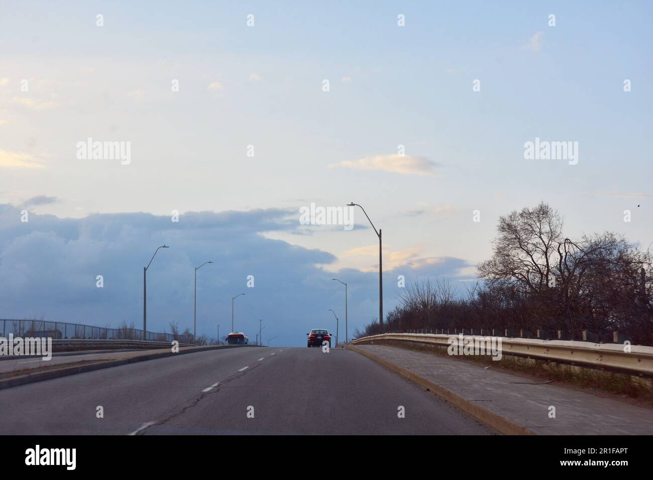 Gatineau,Canada,26.04.2023: Landscape image of local highway with view of single vehicle on the horizon Stock Photo