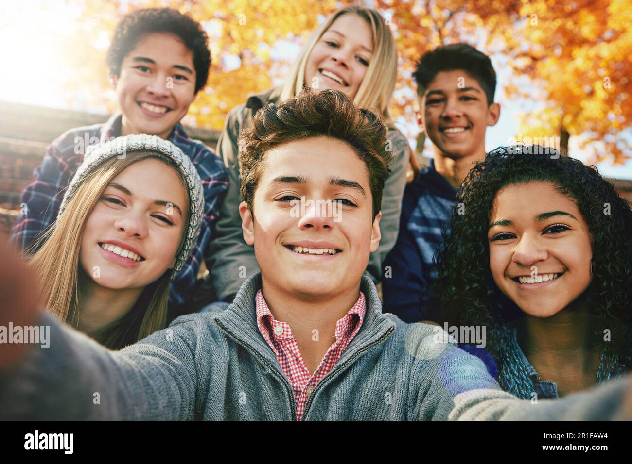 Selfie with friends. Friendly smiling teenagers making group photo