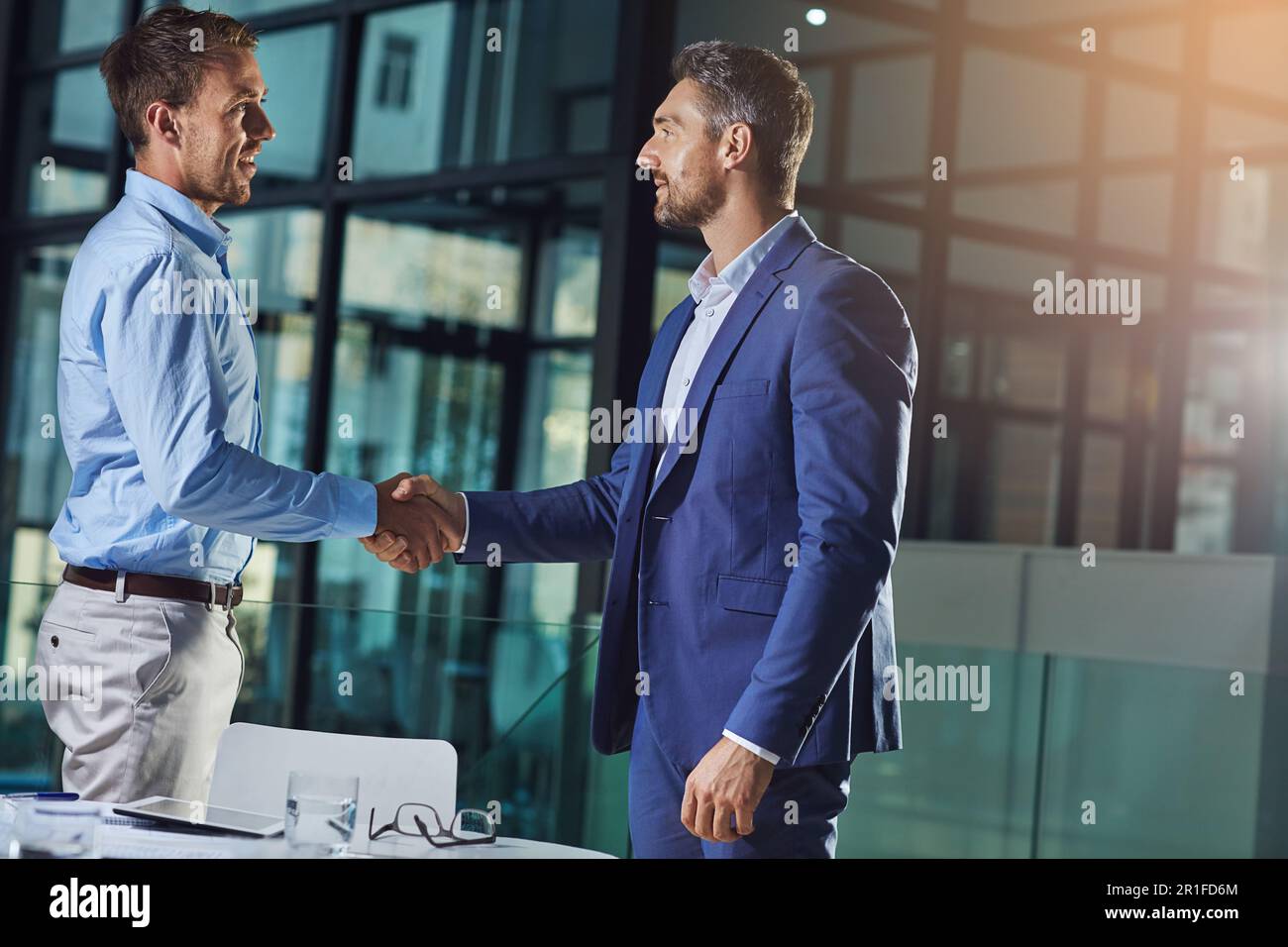 Business people, handshake and b2b success or partnership, agreement and networking in office. Corporate, men and executive shaking hands with new Stock Photo