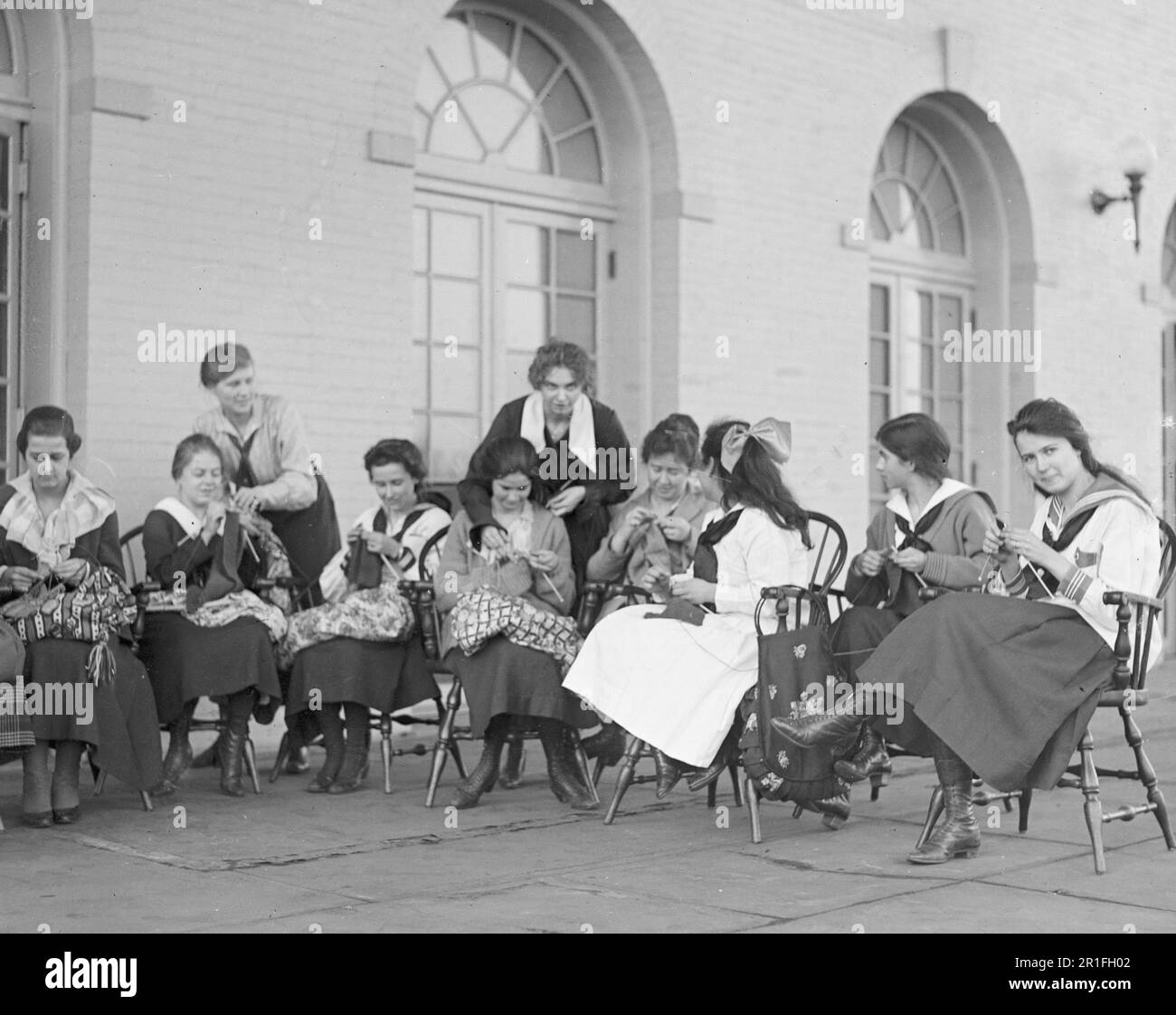 Archival Photo: Group of women knitting in public schools vocational studies ca. 1918-1920 Stock Photo