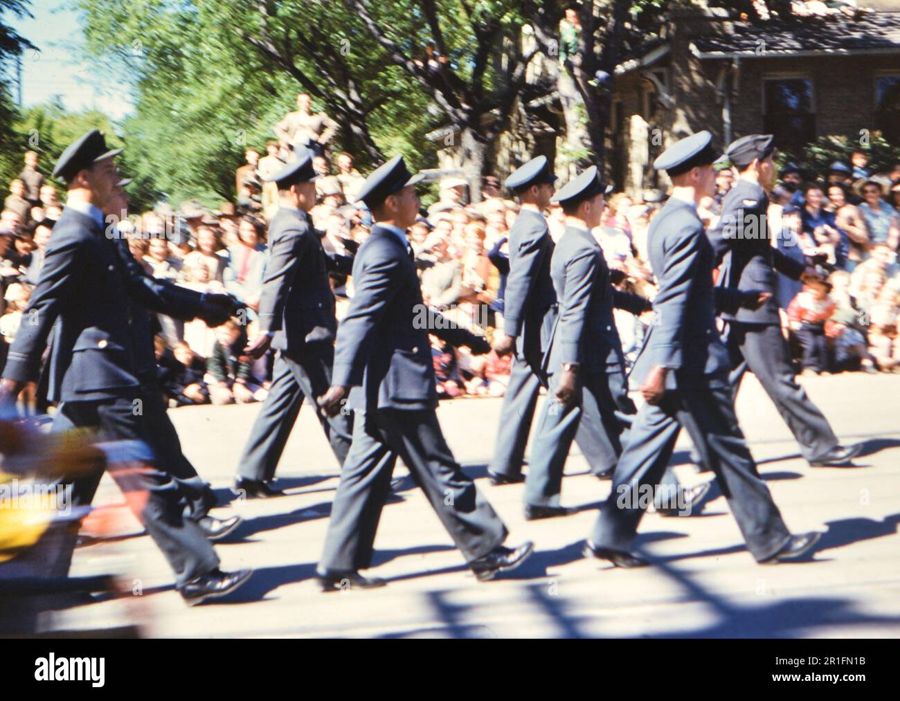 Members of the military marching in a parade ca. 19501955 Stock Photo