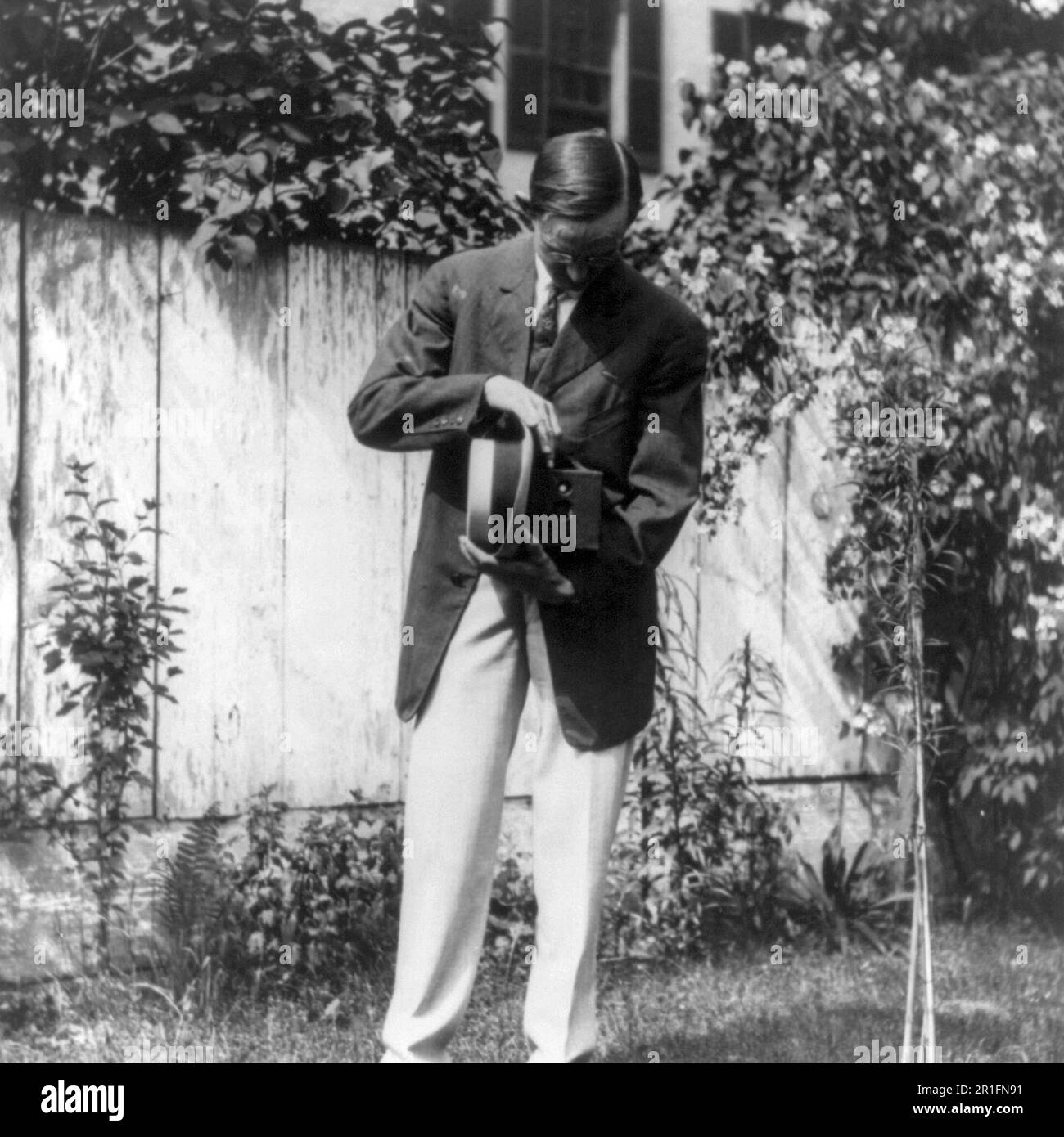 Archival Photo: Herbert E. French using a box camera ca. 1909 Stock