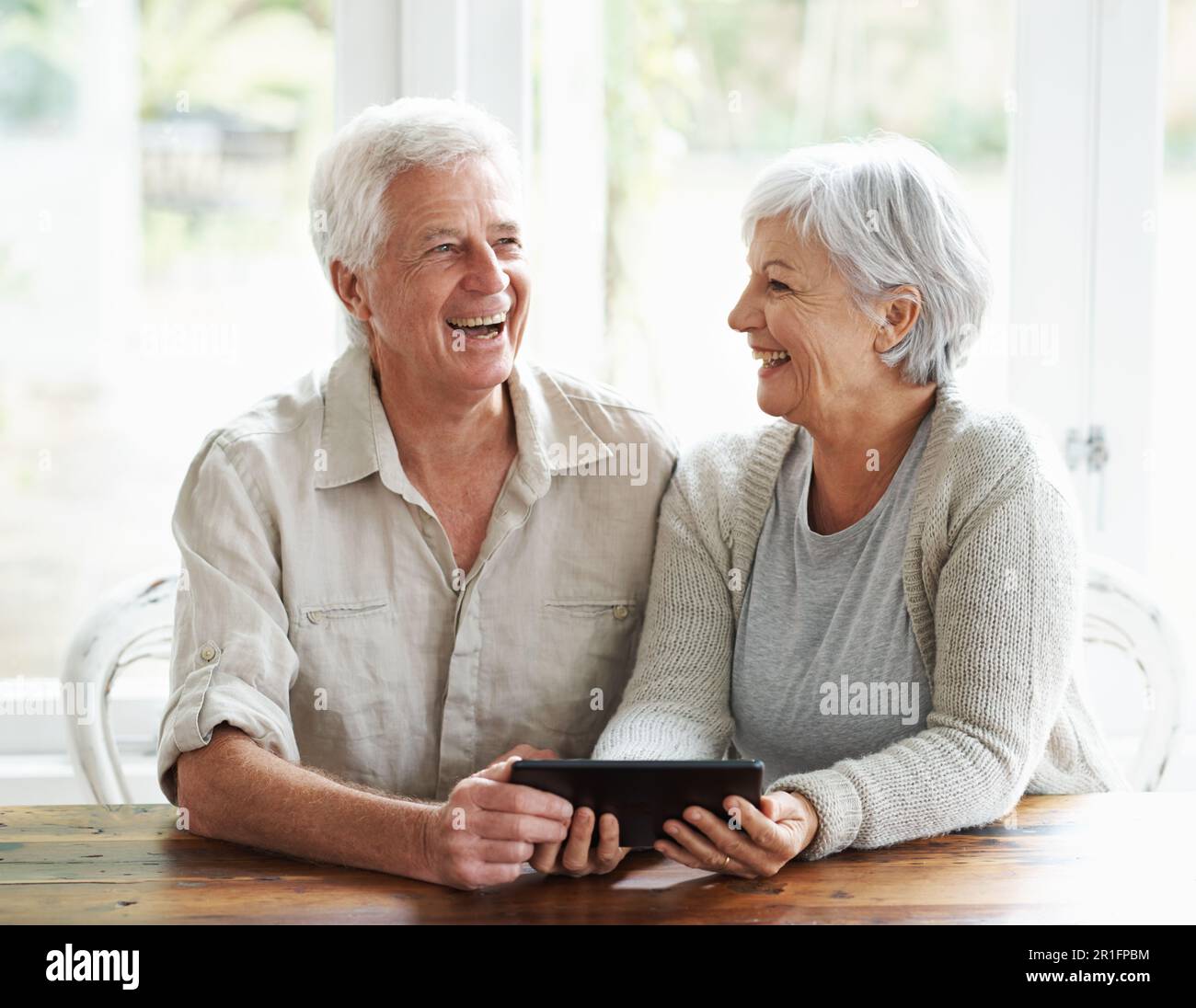 Tablet, senior couple and laughing in home on social media, funny news and  online meme. Happy old man, woman and relax with digital technology Stock  Photo - Alamy, image size:1300x1096