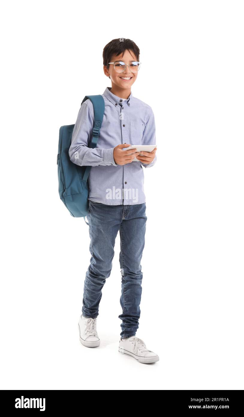 Little schoolboy using tablet computer on white background Stock Photo ...
