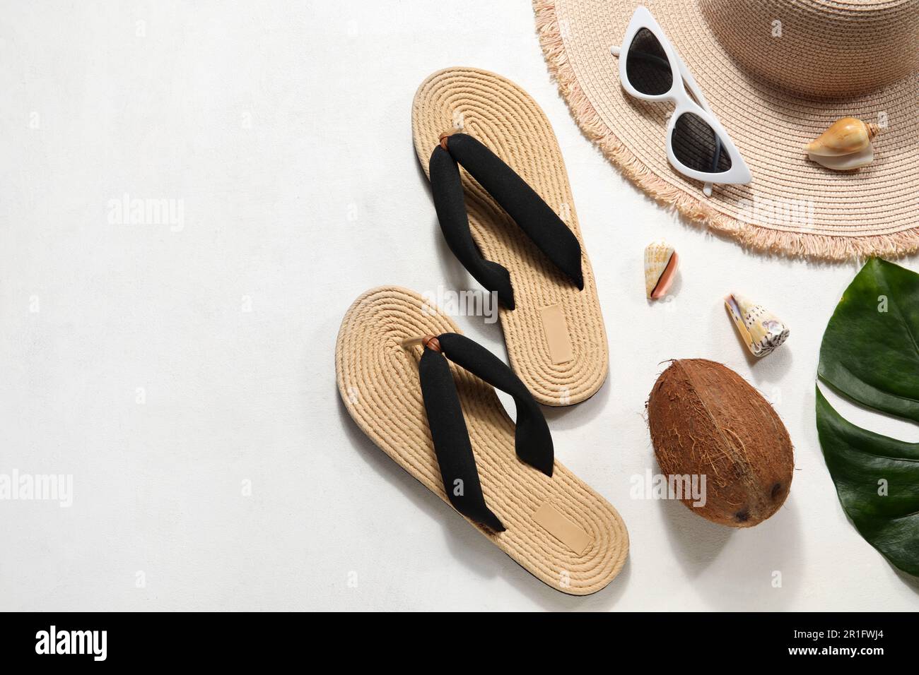 Flip flops with sunglasses and hat on white background Stock Photo - Alamy