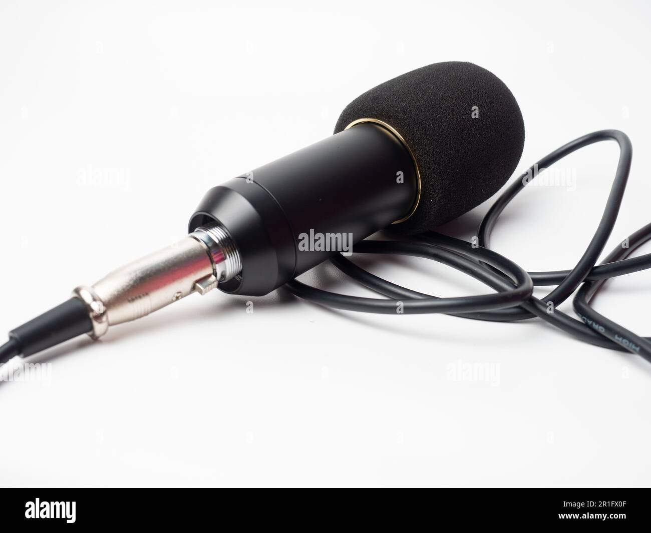 Picture of a black condenser microphone on a white isolated background