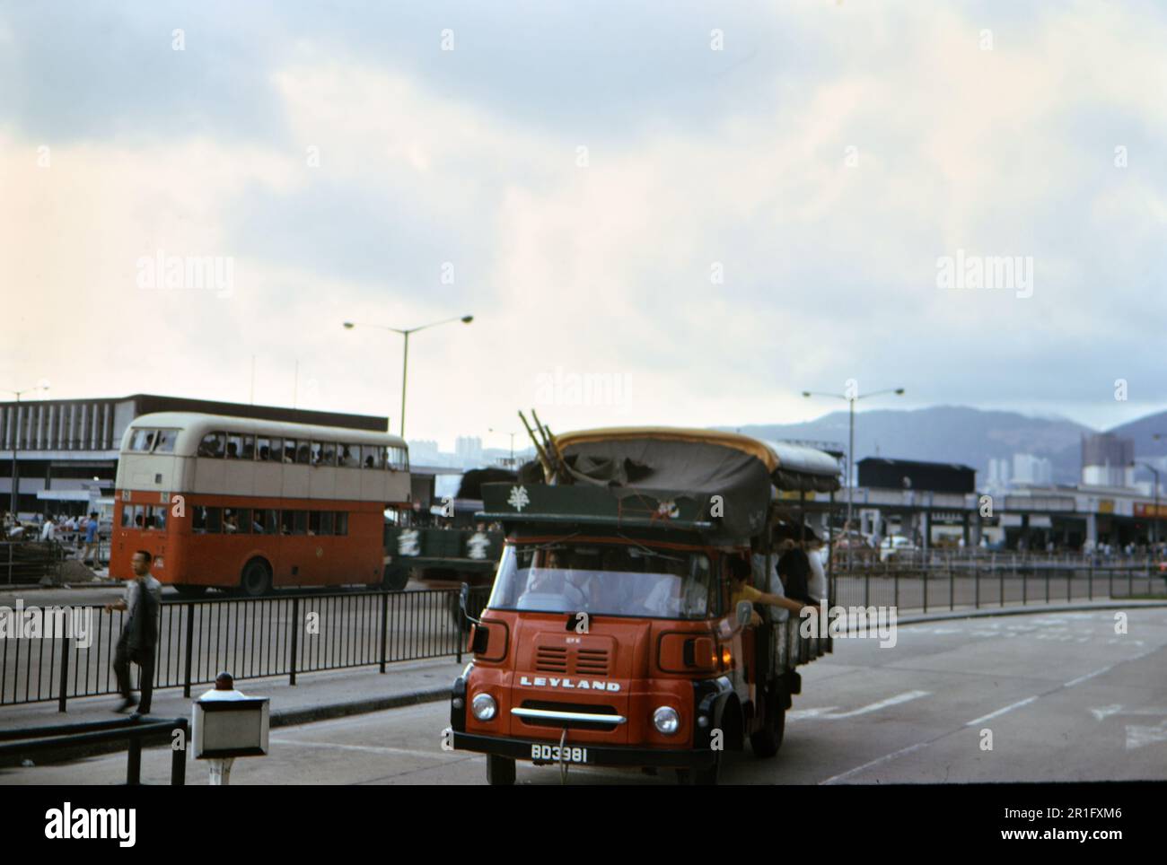 Public transportation in Hong Kong, double decker bus and Leyland small truck vehicle ca. 1973 Stock Photo