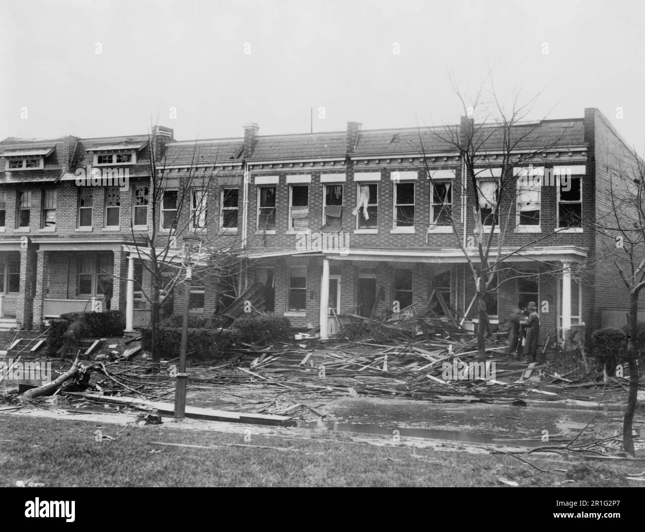 Archival Photo: Row houses at 1216 - 1226 C St. SE, Washington D.C., severely damaged by a tornado on Nov. 17, 1927 Stock Photo
