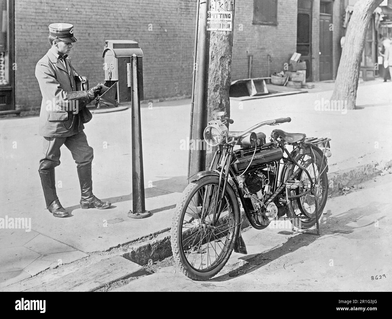 Archival Photo: U.S. mailman & motorcycle ca. 1910s or 1920s Stock Photo