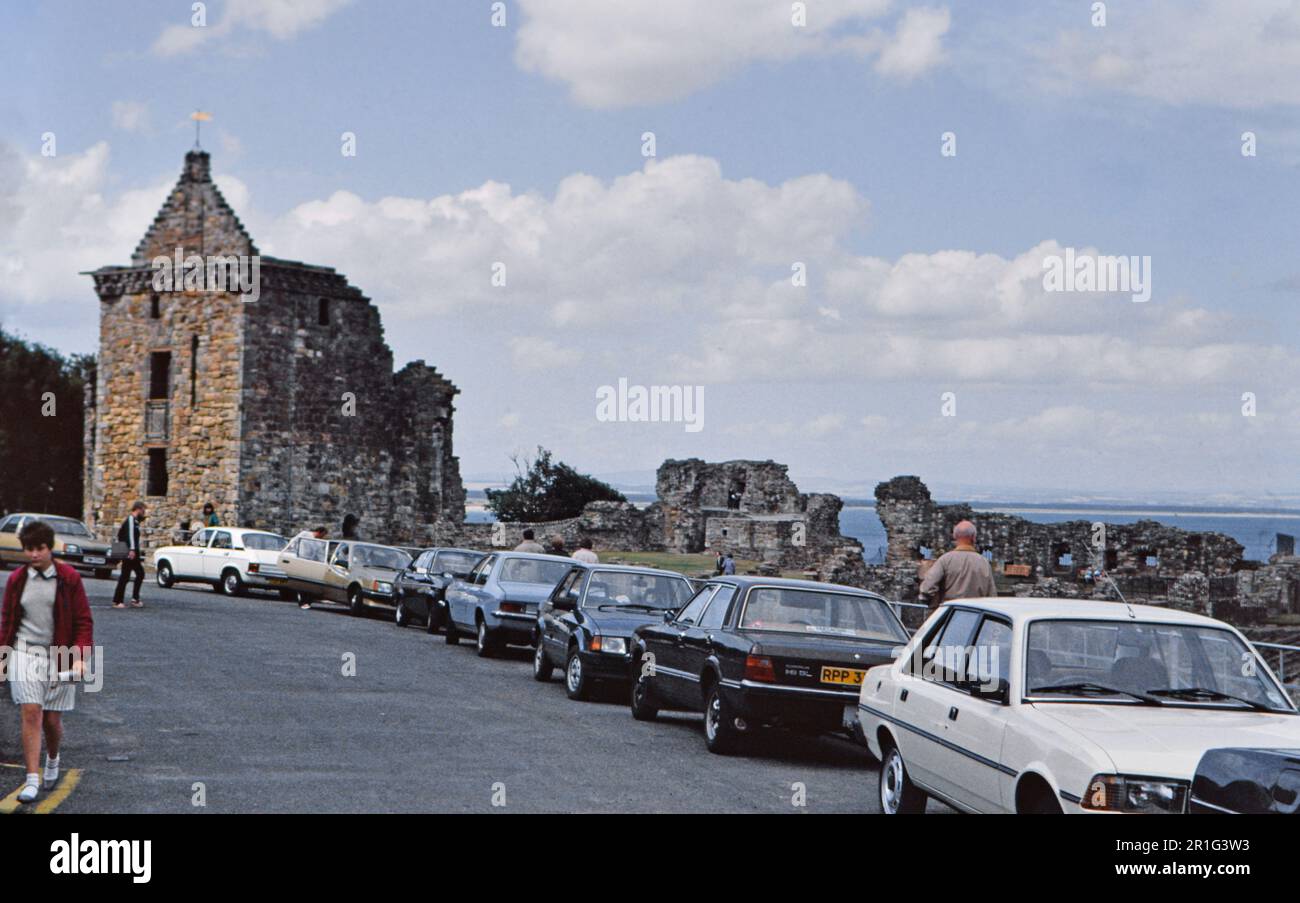 Cars parked on the road near St. Andrews Castle in Scotland, UK ca. 1982 Stock Photo