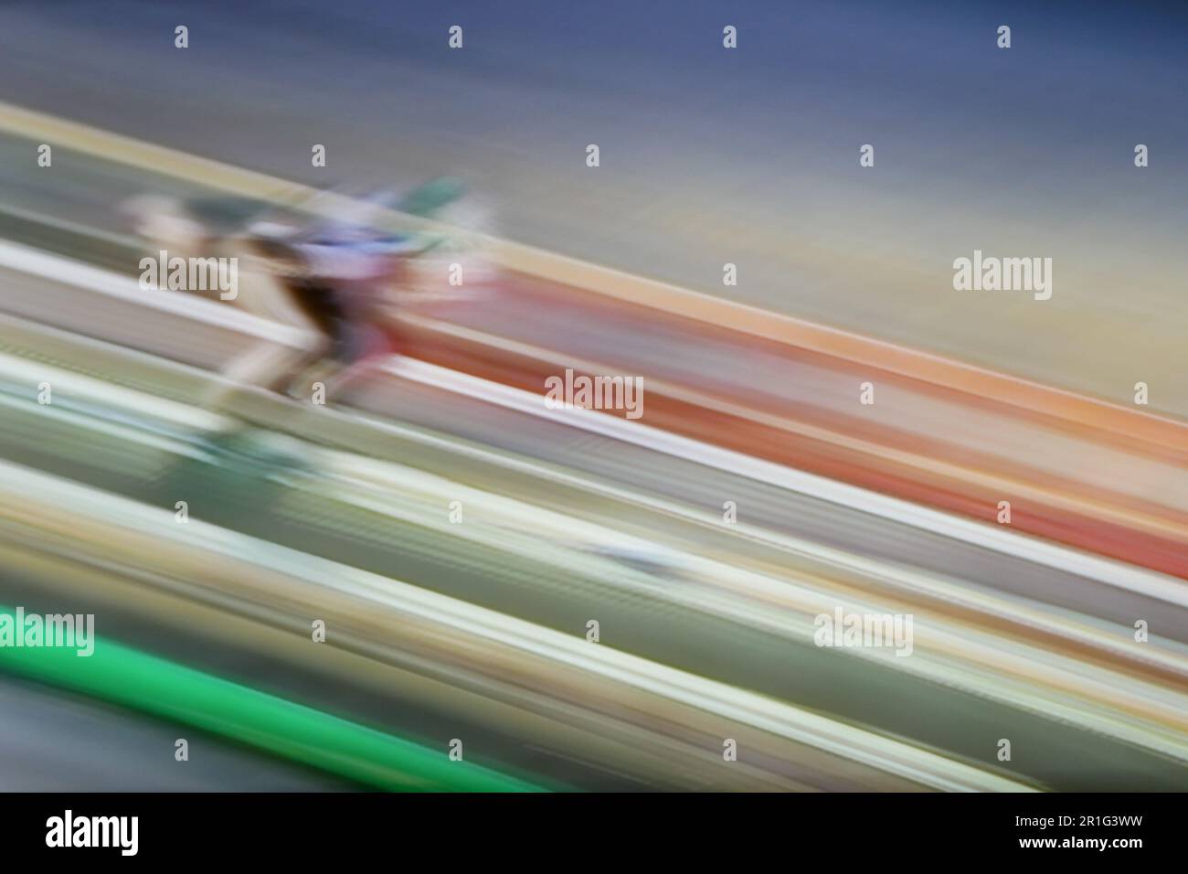 blurred ski jumping with speed in colorful lights Stock Photo