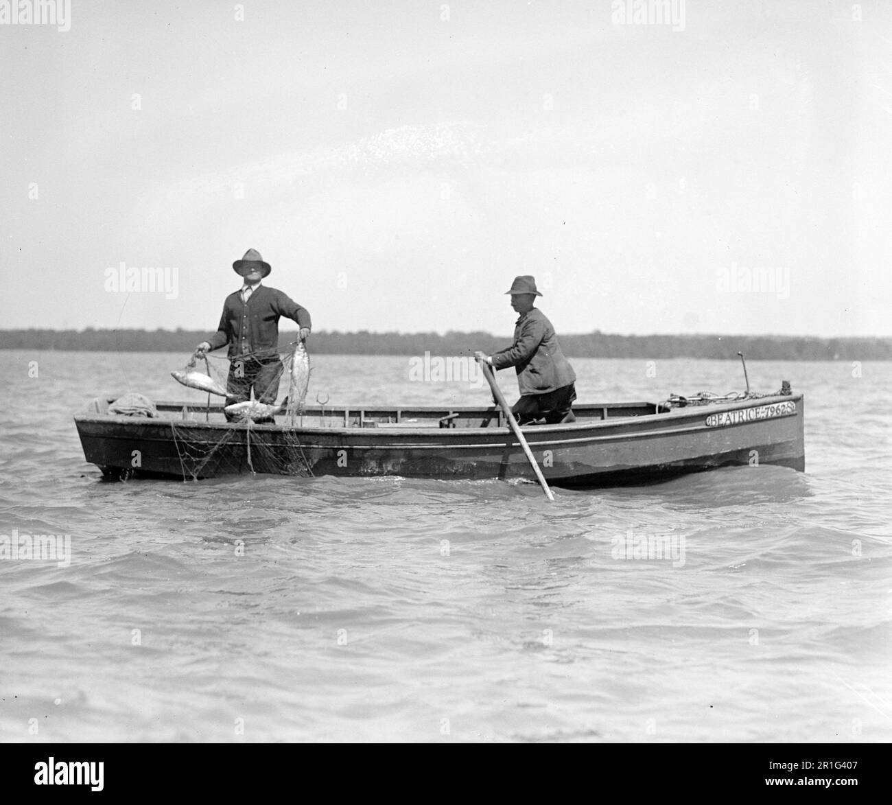 Two men fishing Black and White Stock Photos & Images - Alamy