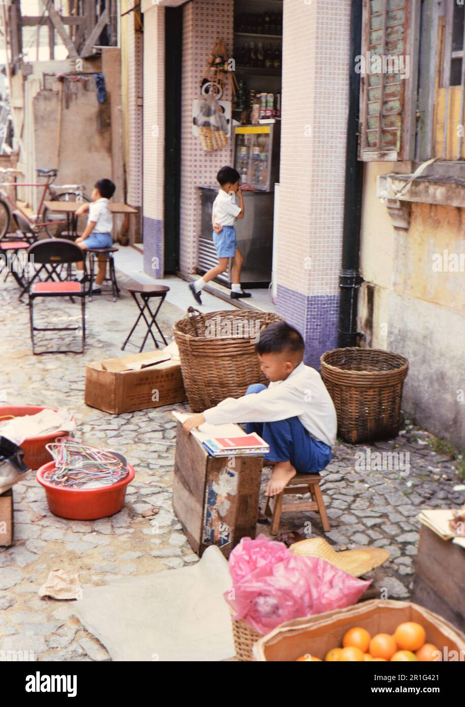 A Young Child In Macau Writing On A Tablet Ca 1973 Stock Photo Alamy A young child in macau writing on a tablet ca 1973 stock photo alamy