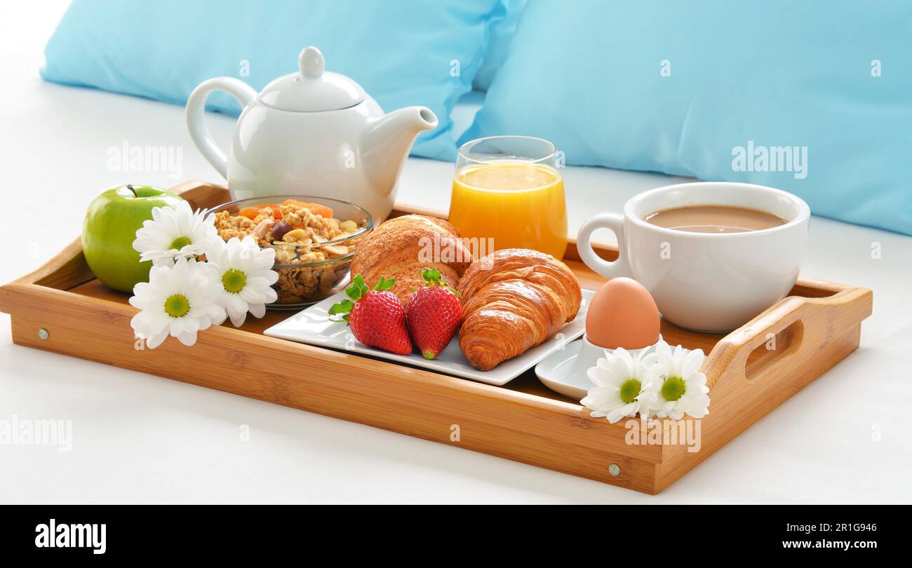 Breakfast tray in bed in hotel room Stock Photo - Alamy