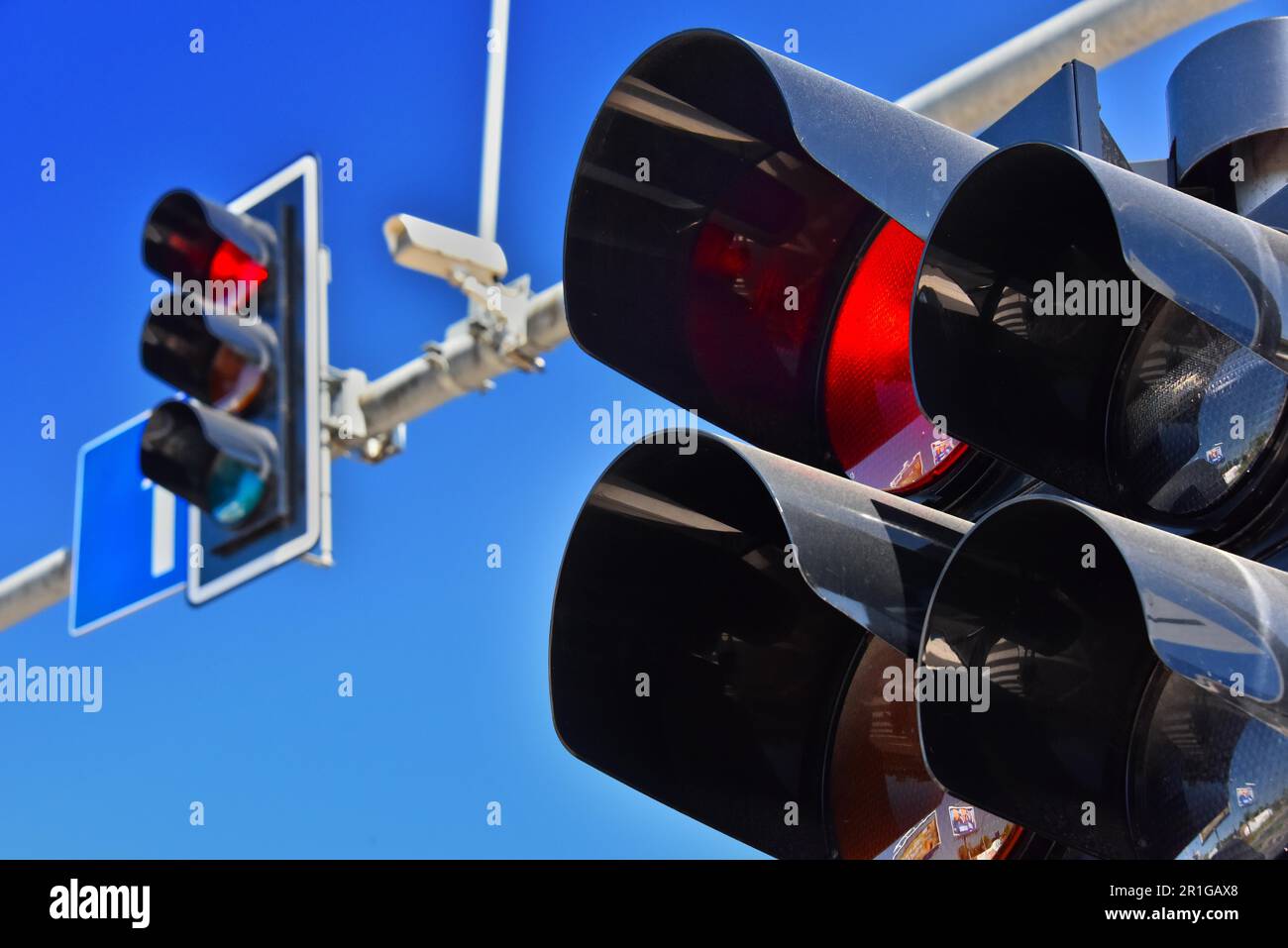 Traffic lights over blue sky Stock Photo Alamy