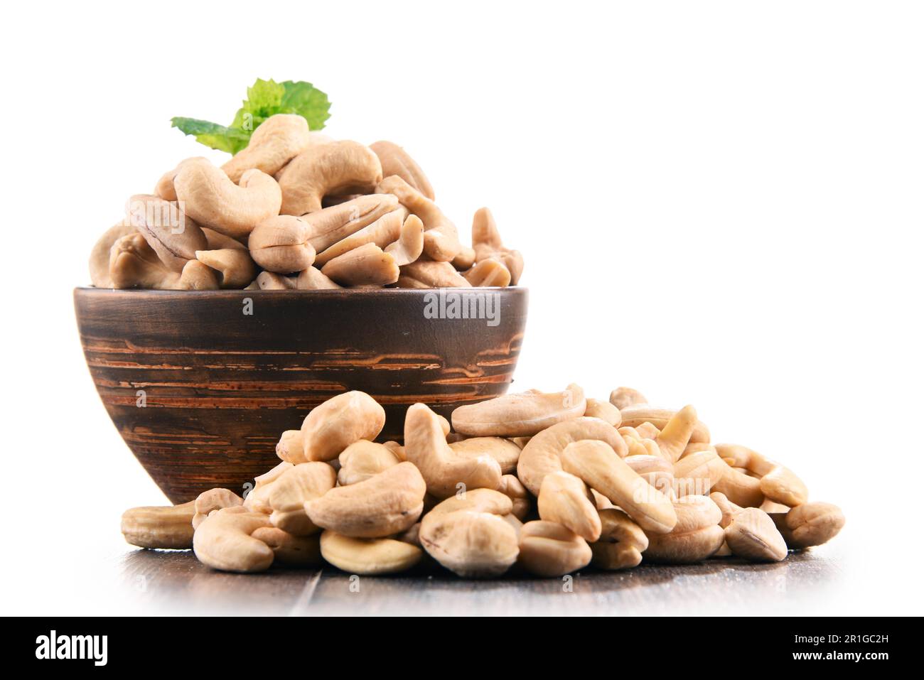 Bowl with cashew nuts isolated on white background Stock Photo