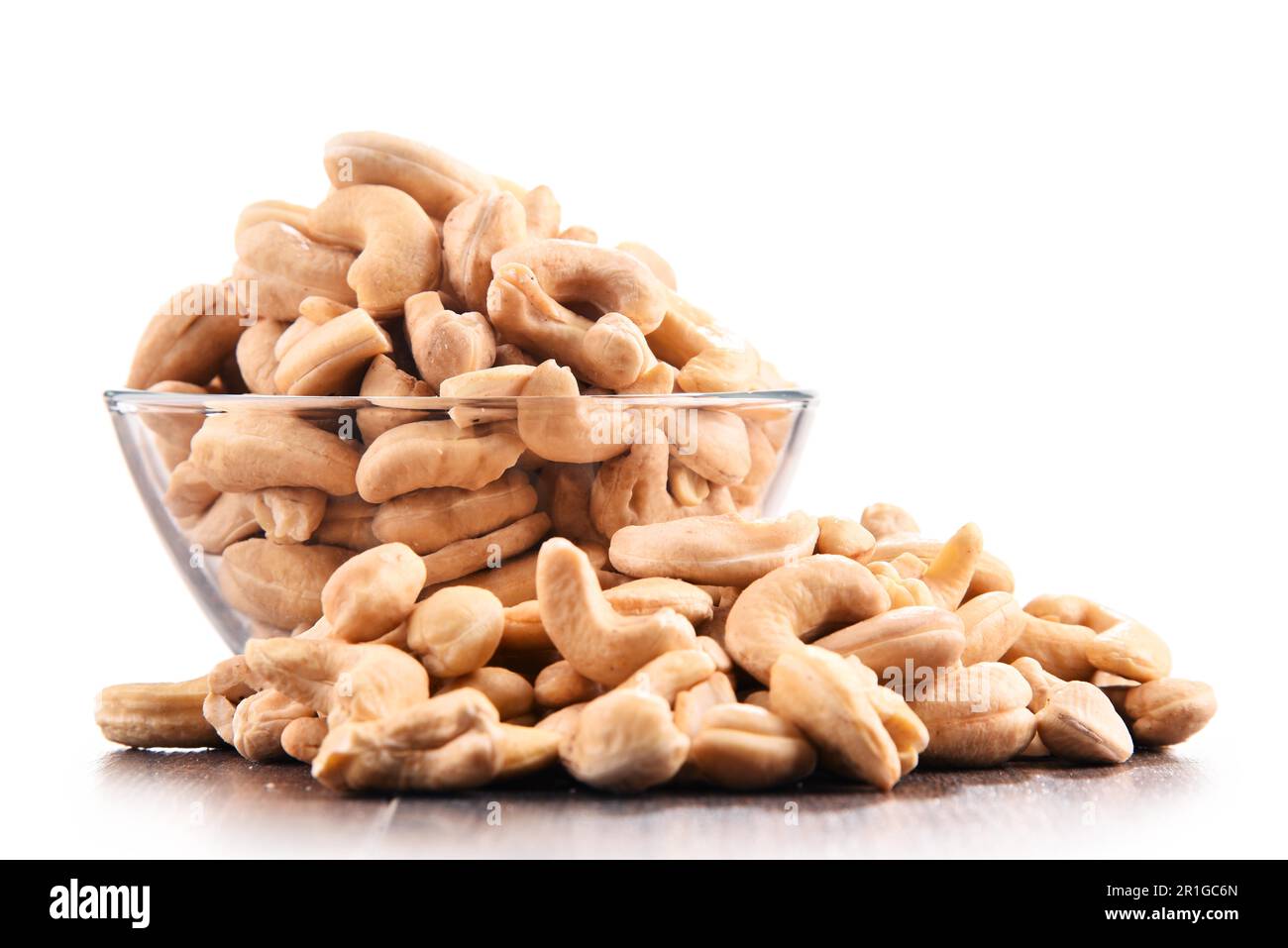 Bowl with cashew nuts isolated on white background Stock Photo
