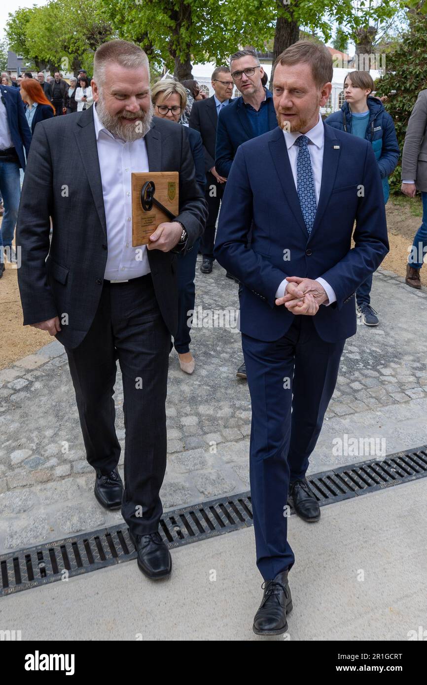 13 May 2023, Saxony, Großschweidnitz: Opening of the memorial Großschweidnitz after two years of construction by Saxony's Prime Minister Michael Kretschmer CDU (r) who talks with Markus Pieper (l), Managing Director of the Foundation Saxon Memorials. Photo: Daniel Schäfer/dpa Stock Photo