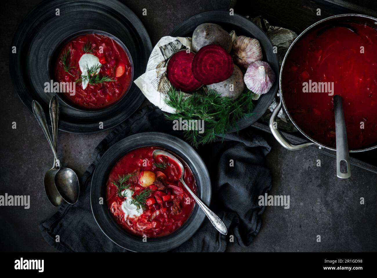 Traditional Eastern European beetroot soup borscht served with dill and sour cream Stock Photo