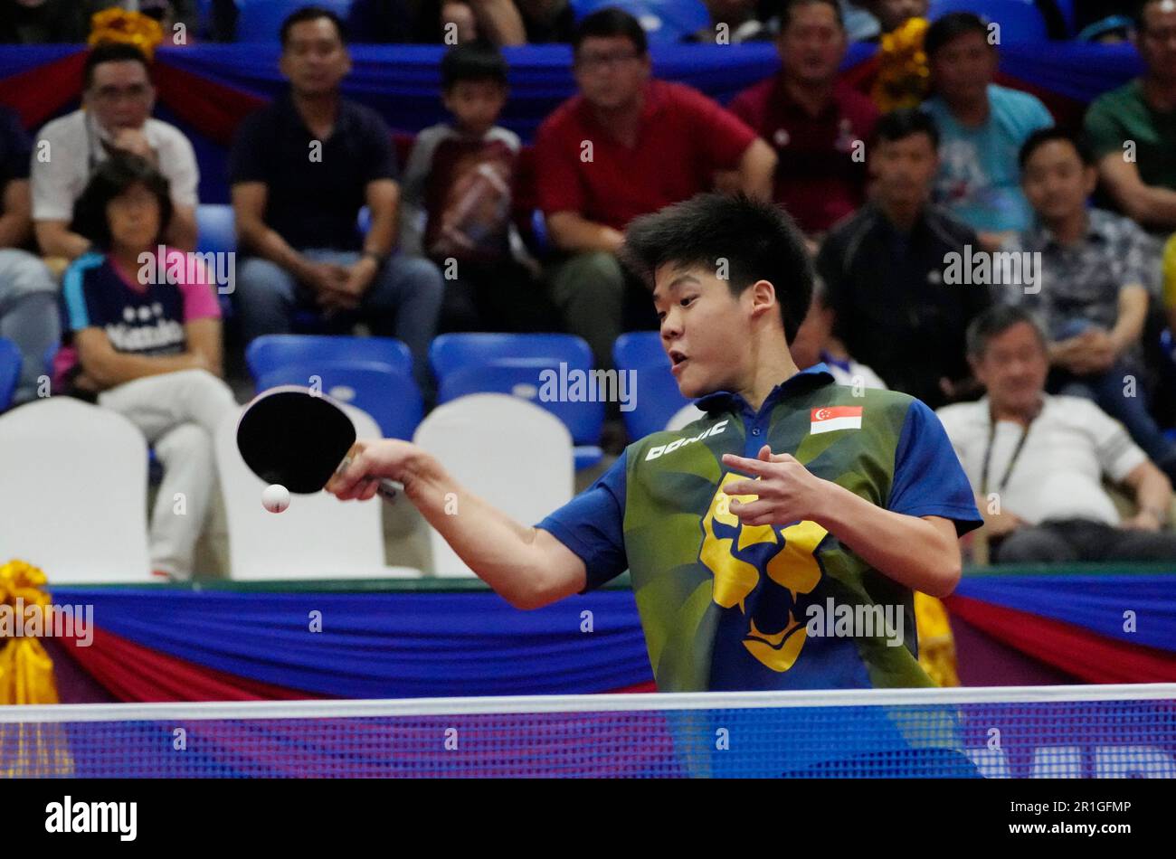Singapore's Yong Isaac Quek returns a shot during men's doubles semi