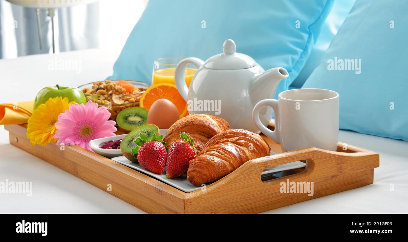Breakfast tray in bed in hotel room Stock Photo - Alamy