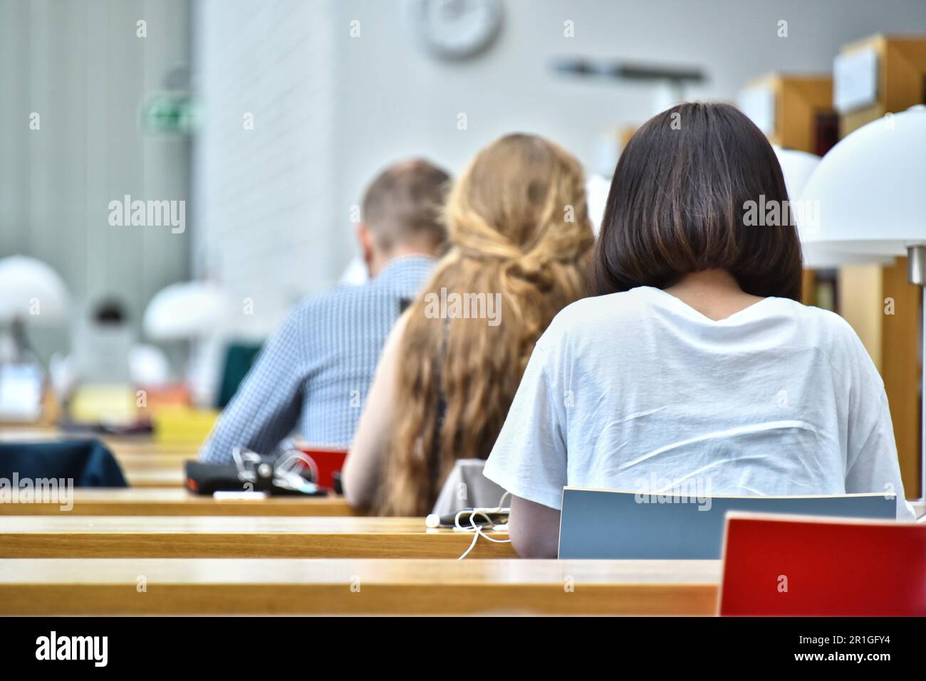 Students reading in a public library Stock Photo