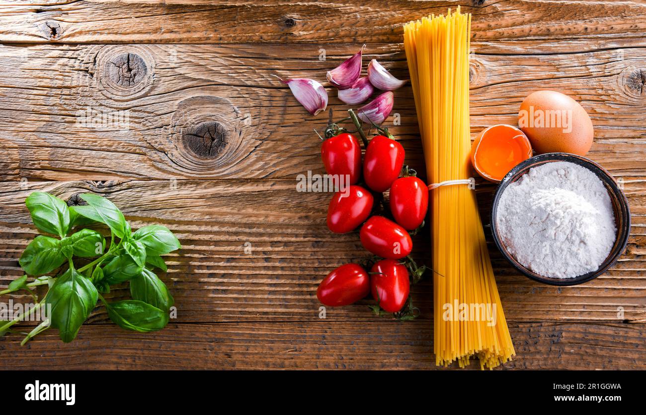 Composition with dried spaghetti, and pasta ingredients Stock Photo