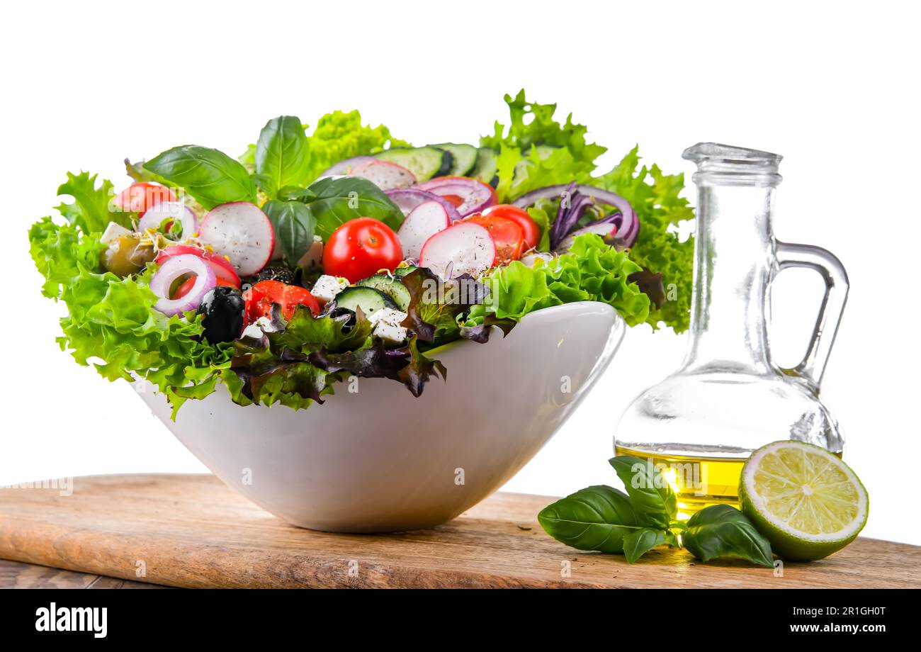 Vegetable salad bowl isolated on white background Stock Photo