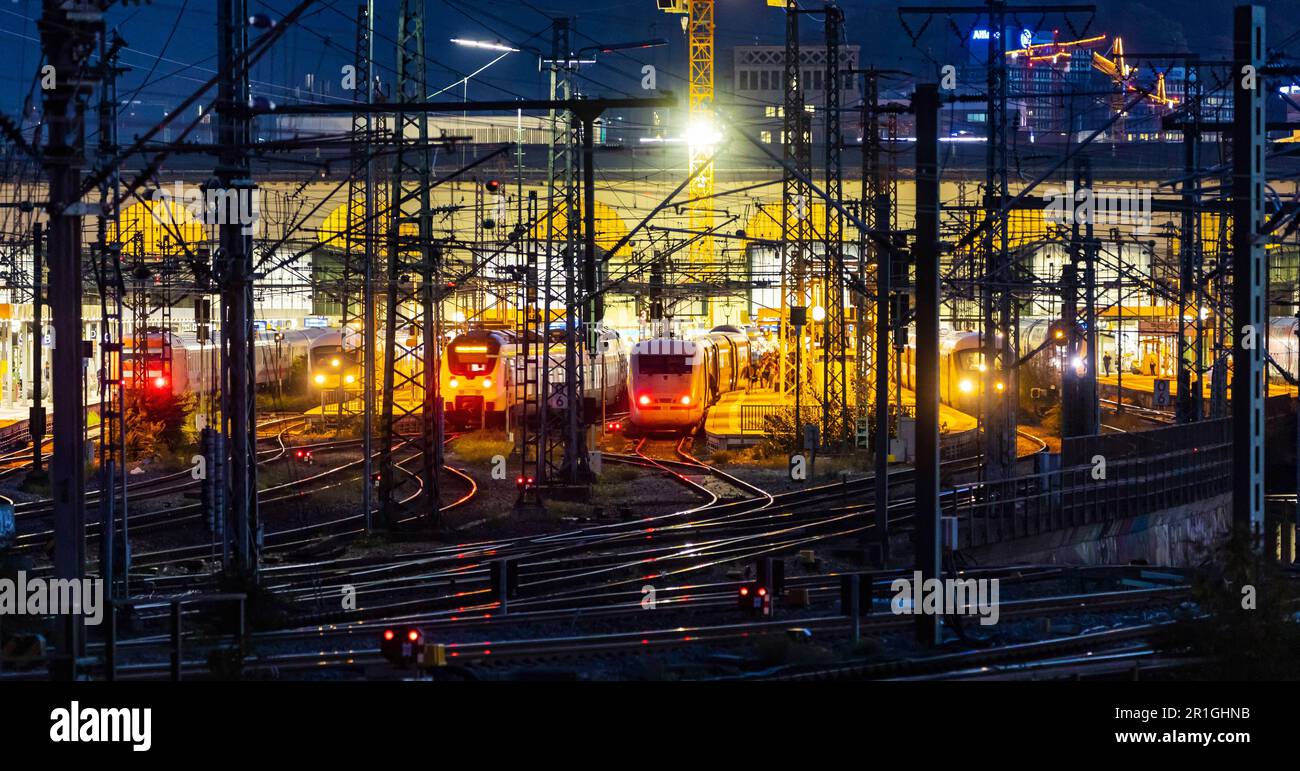 Main station in the evening, illuminated tracks and platforms with ICE, in the background the Bonatzbau, Stuttgart, Baden-Wuerttemberg, Germany Stock Photo