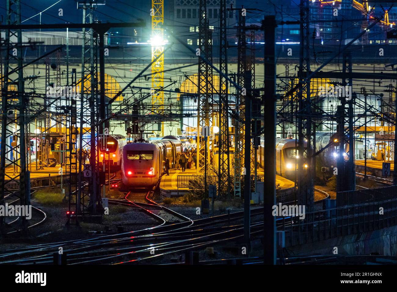 Main station in the evening, illuminated tracks and platforms with ICE, in the background the Bonatzbau, Stuttgart, Baden-Wuerttemberg, Germany Stock Photo
