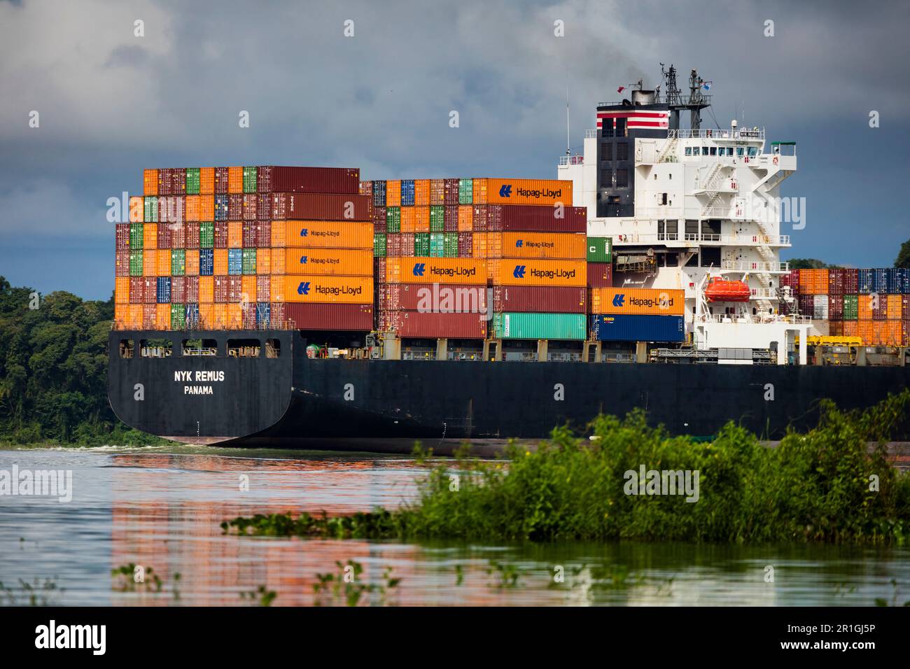 Panama Canal landscape with the container ship Nyk Remus in transit