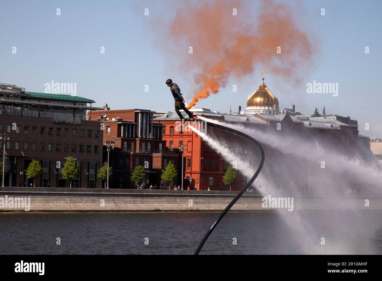 Moscow, Russia. 13th May, 2023. Acrobatics with flyboard during marking the Motoseason opening on Crimea embankment in Muzeon Park in Moscow, Russia Stock Photo