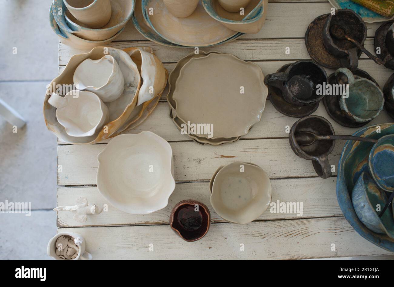 finished pottery in glaze on the table. Stock Photo