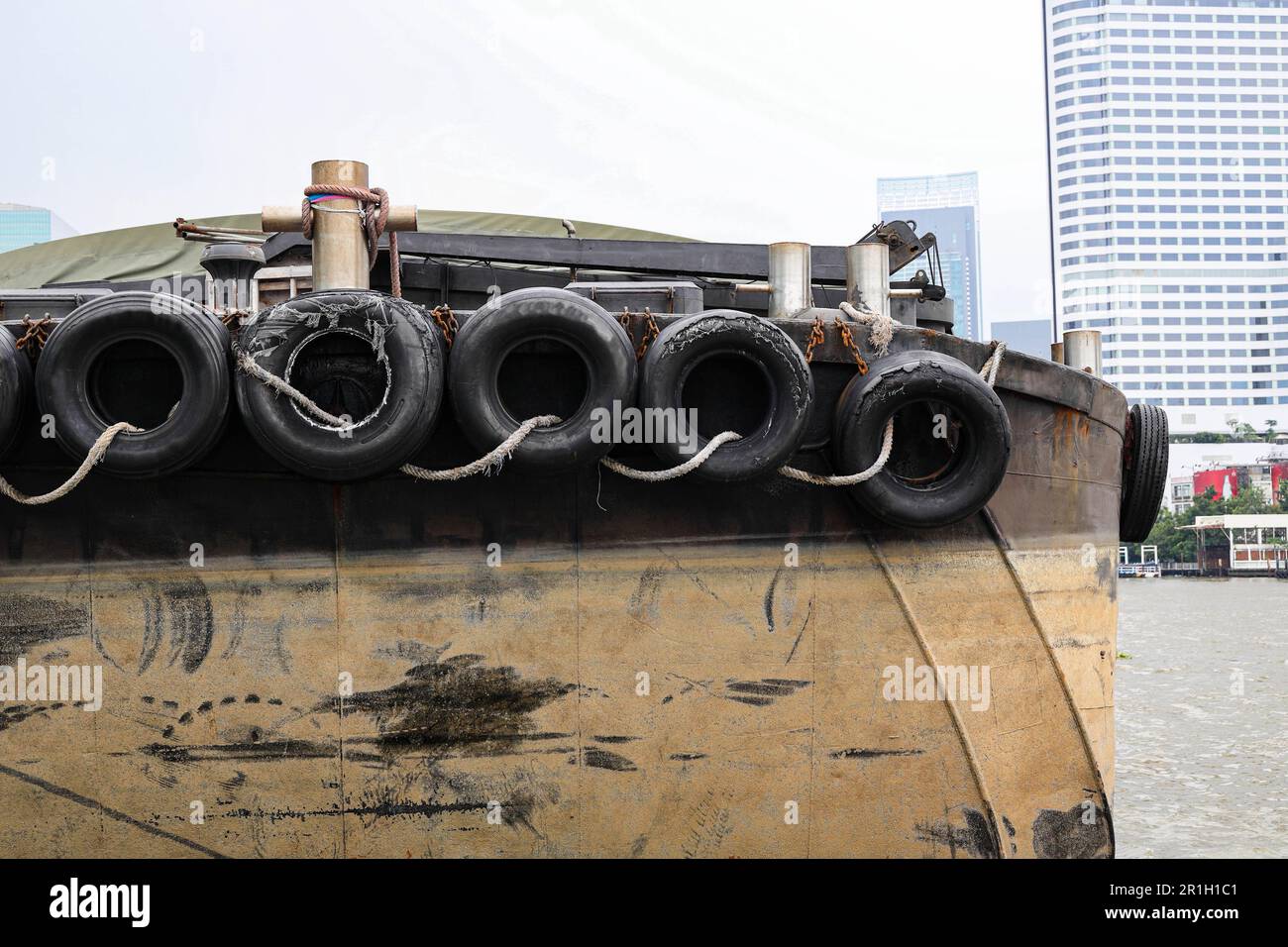 old car tires used as a boat cushion with others and at ferry pier Stock Photo Alamy