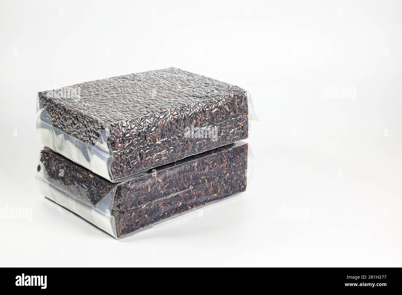 Riceberry rice in transparent plastic vacuum sealed bag isolated on