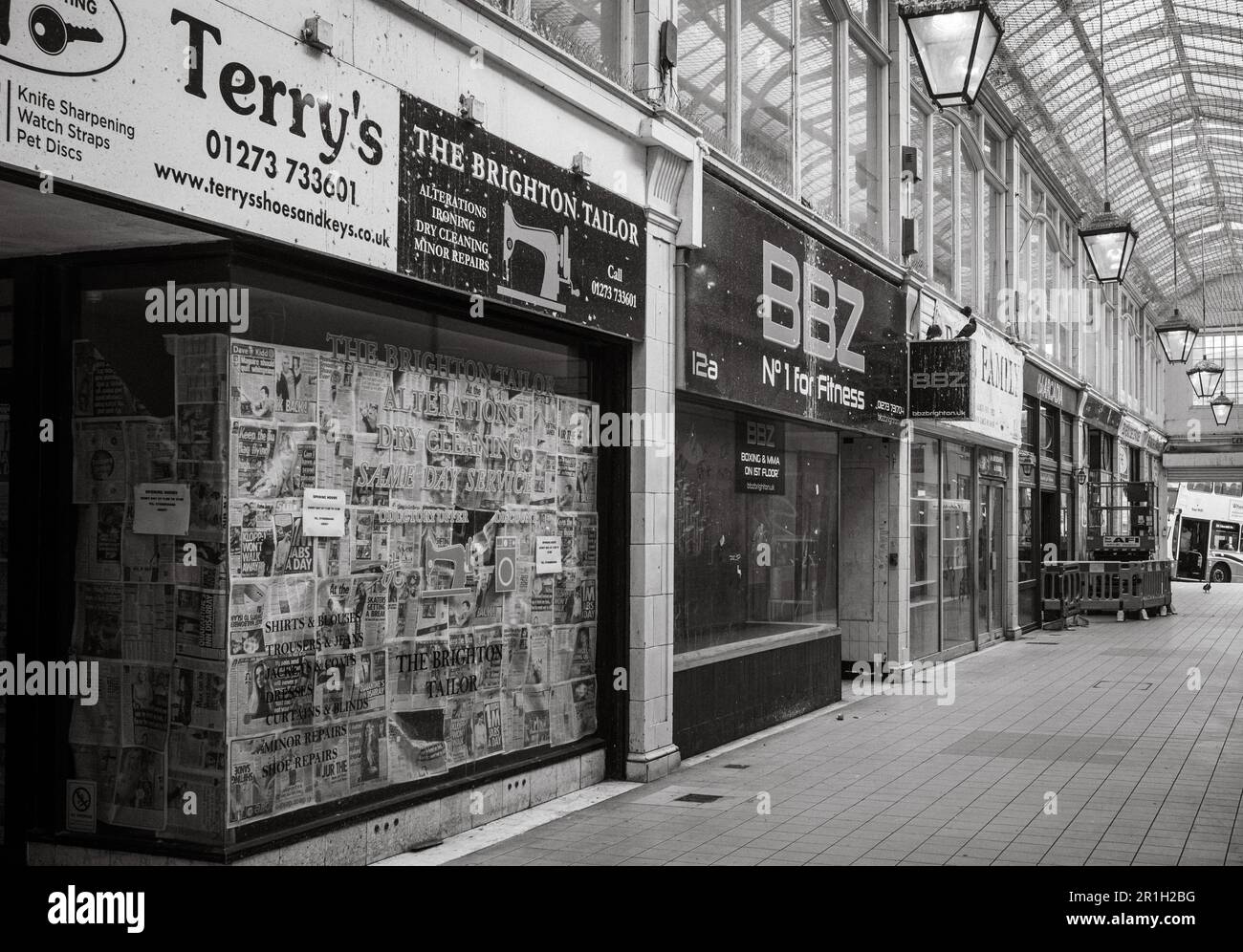 The famous Art Deco style Imperial Arcade in Brighton, UK, lined with empty and abandoned shops. Physical shops businesses suffer from losing business Stock Photo