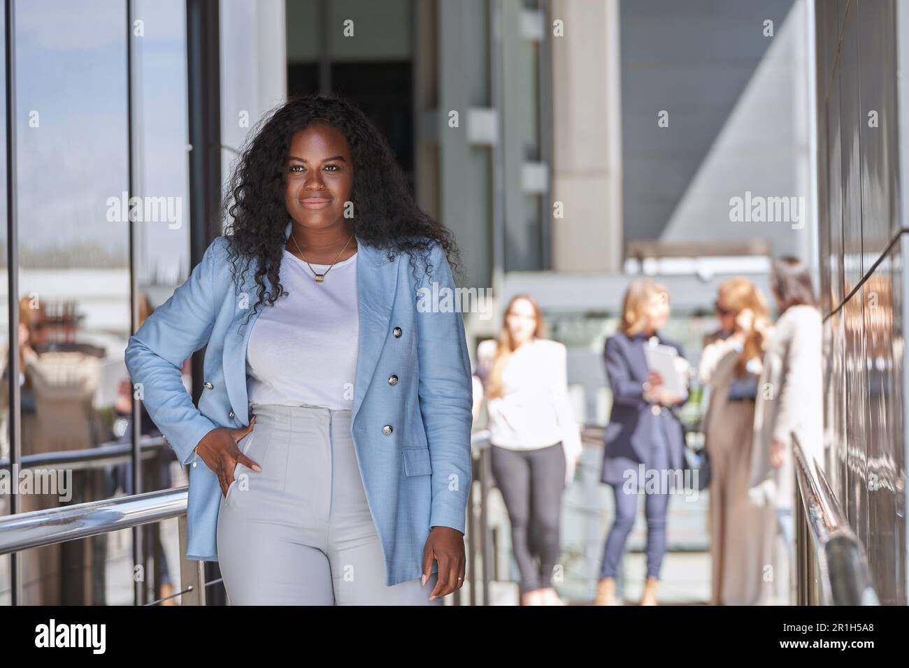 Confident African American Businesswoman Poses for a Photo Shoot in the ...
