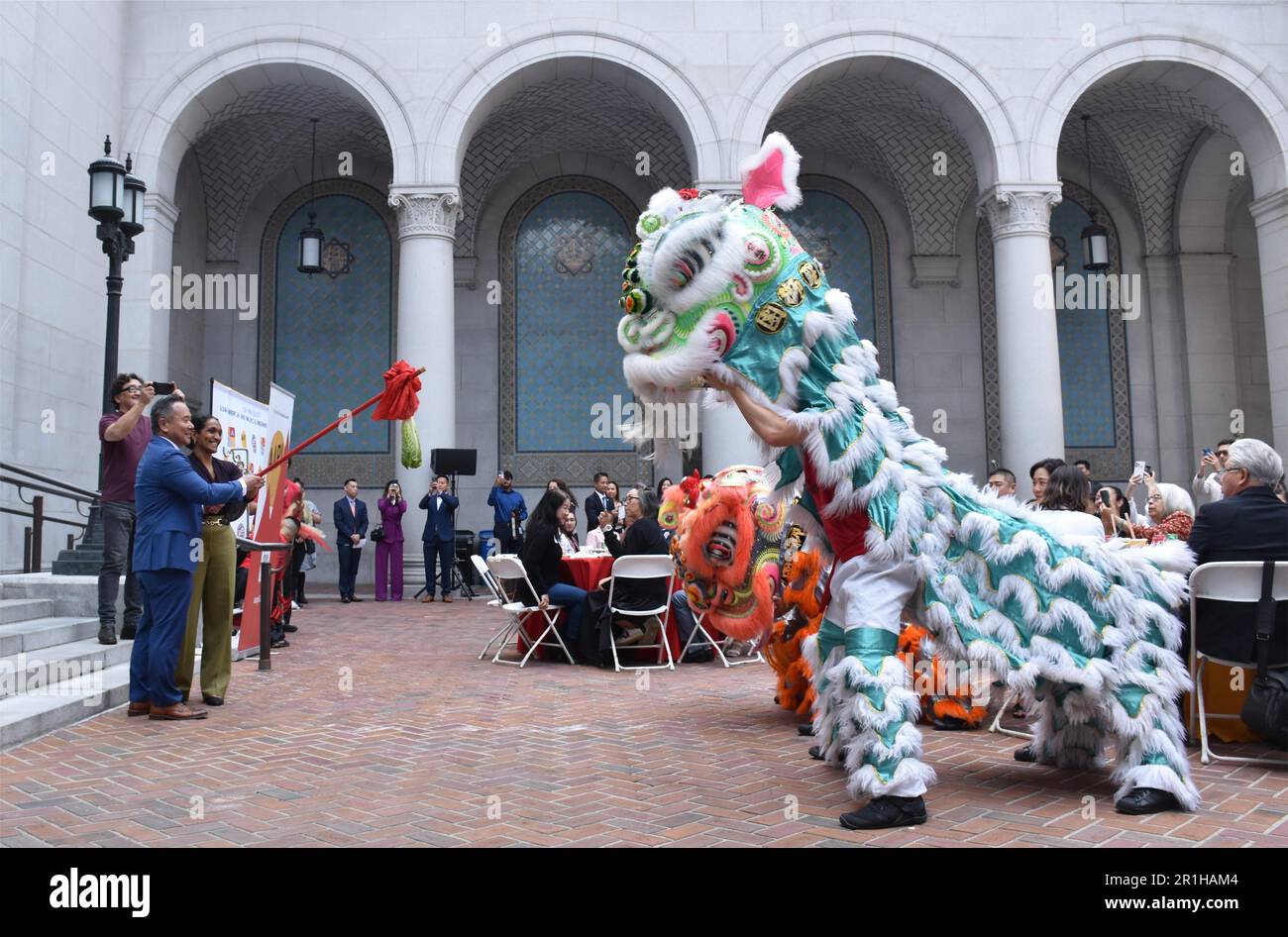 Los Angeles, USA. 12th May, 2023. People perform lion dance at the opening ceremony of the Asian American and Pacific Islander Heritage Month held in the Spring Court of Los Angeles City Hall in Los Angeles, the United States, on May 12, 2023. TO GO WITH 'Feature: Los Angeles celebrates Asia Pacific heritage month' Credit: Zeng Hui/Xinhua/Alamy Live News Stock Photo