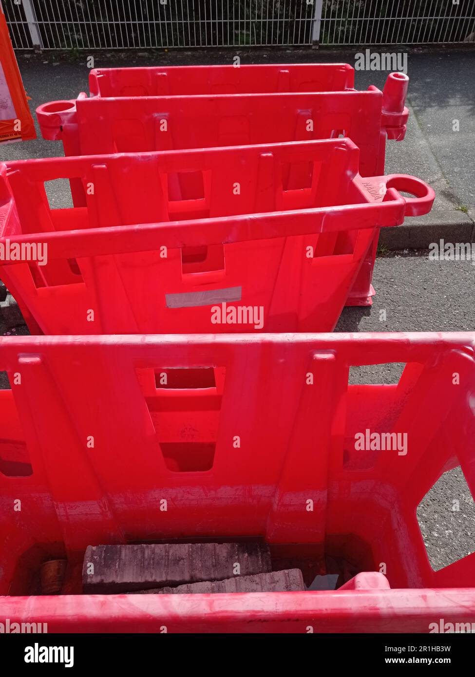 Trois bacs rouges pour travaux de la voierie, France Stock Photo - Alamy
