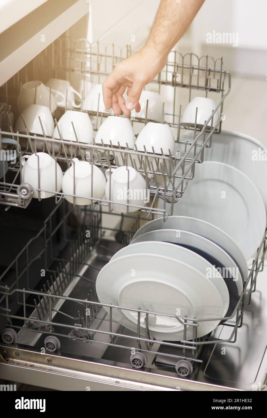 Dishwasher machine cleaning and hands of person washing dirty kitchenware for easy housekeeping hygiene and housework. Closeup of electrical Stock Photo Alamy